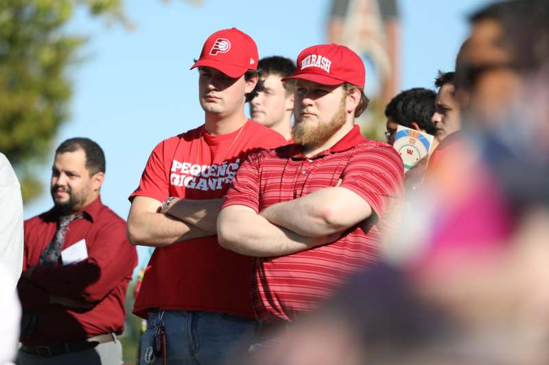 a group of men standing in a crowd