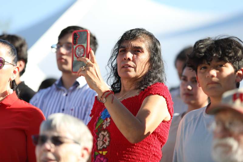 a woman taking a selfie with a red phone