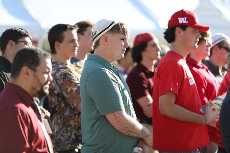 a group of men standing in a line
