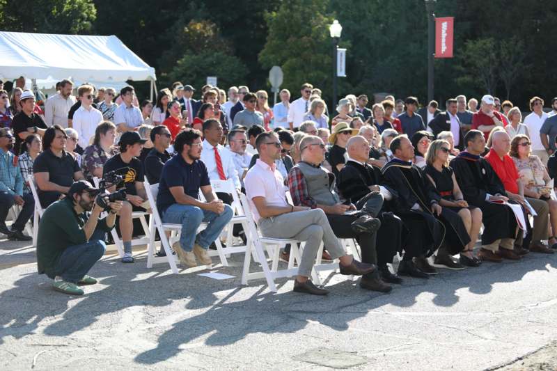 a group of people sitting in chairs