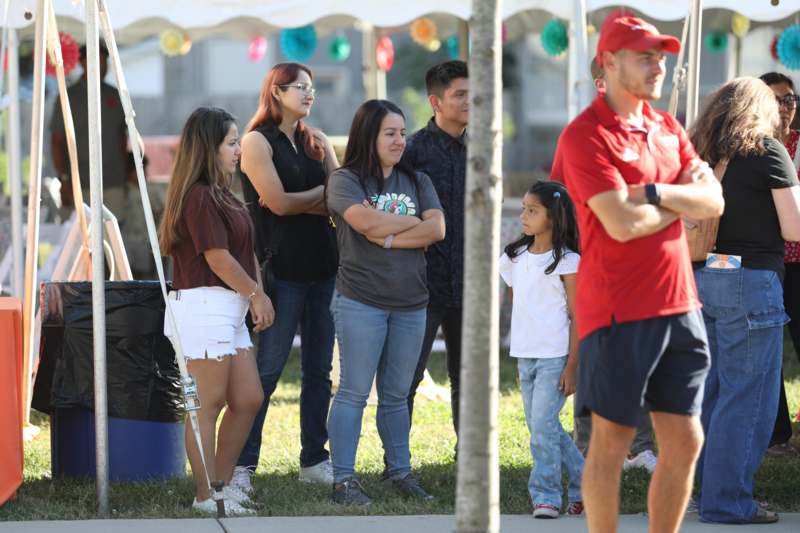 a group of people standing in a line