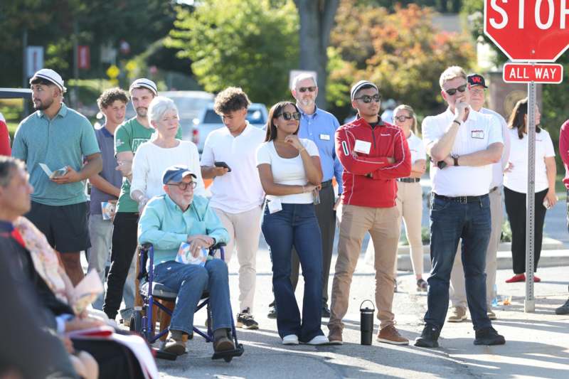 a group of people standing on a street