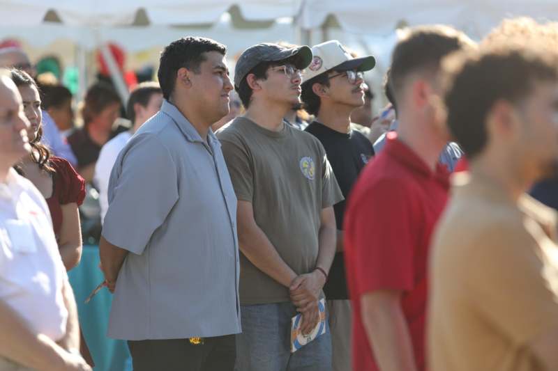 a group of men standing in a crowd