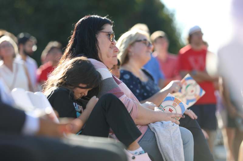 a group of people sitting in a crowd