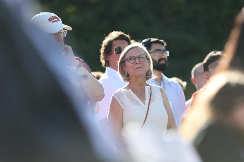 a group of people standing in a crowd
