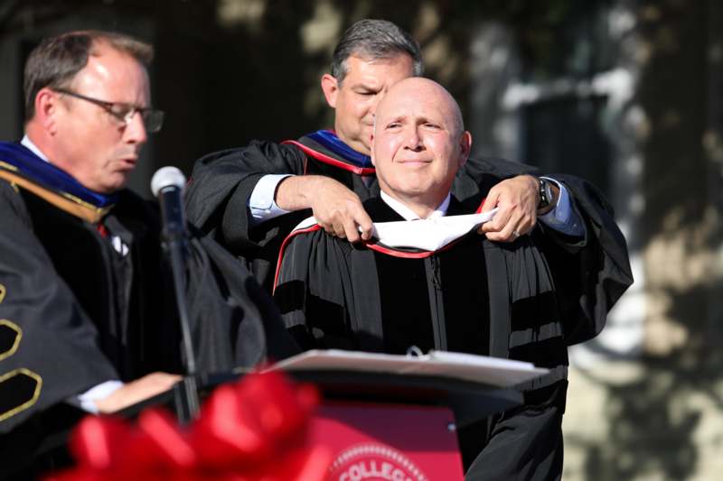 a man in a graduation gown