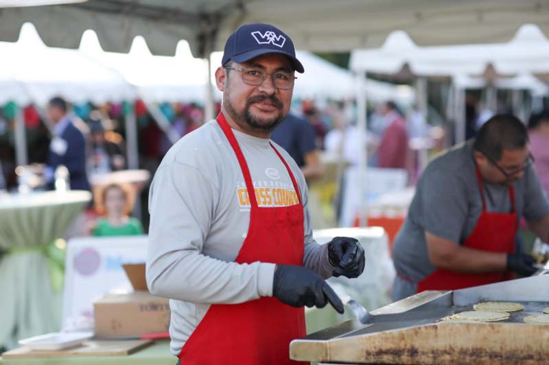 a man wearing a hat and apron