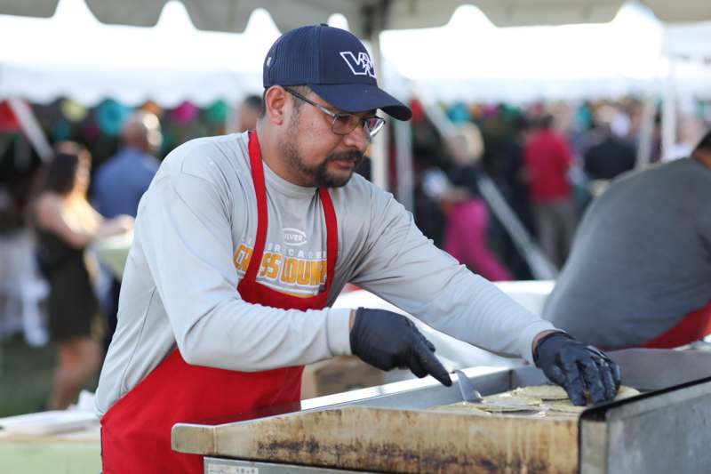 a man cooking food outside