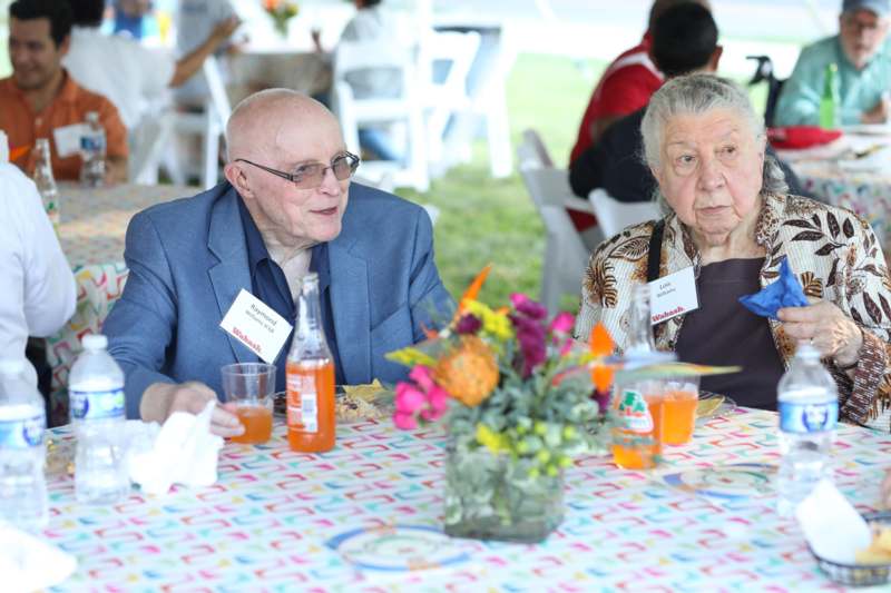 a man and woman sitting at a table