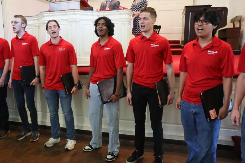 a group of people wearing red shirts
