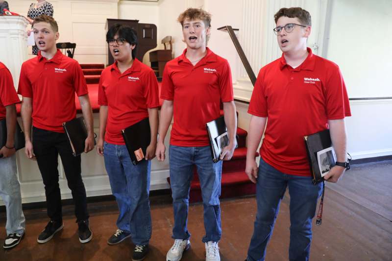 a group of men wearing red shirts
