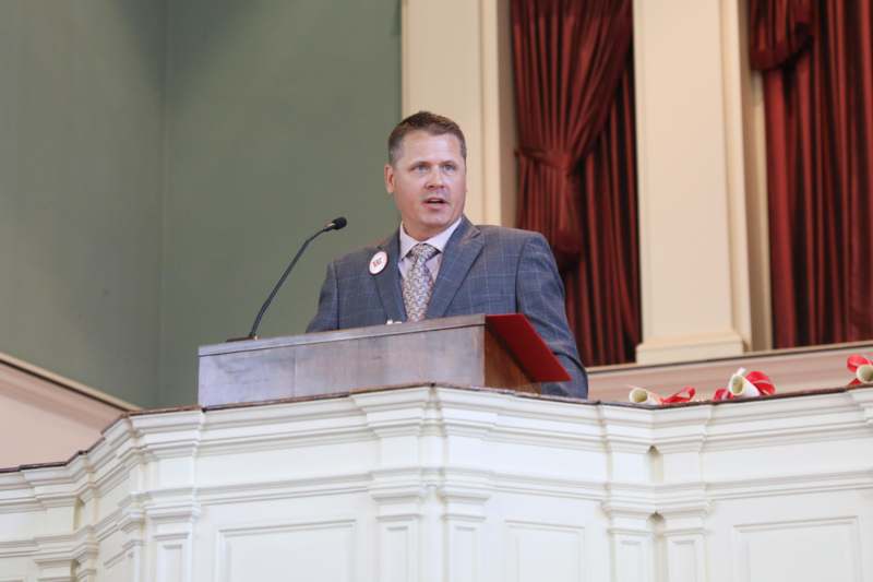 a man standing at a podium