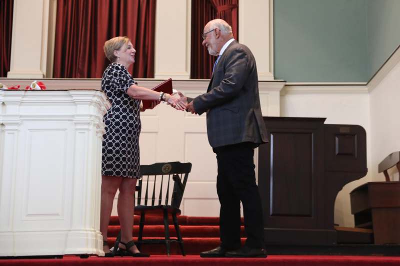 a man and woman shaking hands