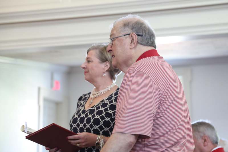 a man and woman standing in a room