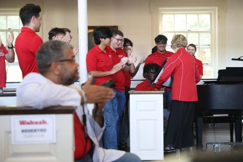 a group of people in red shirts