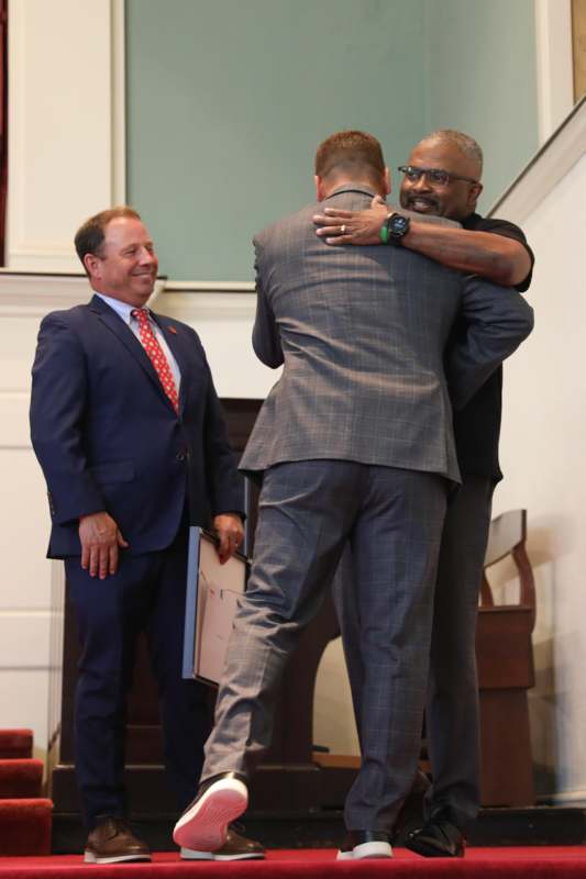 a group of men hugging