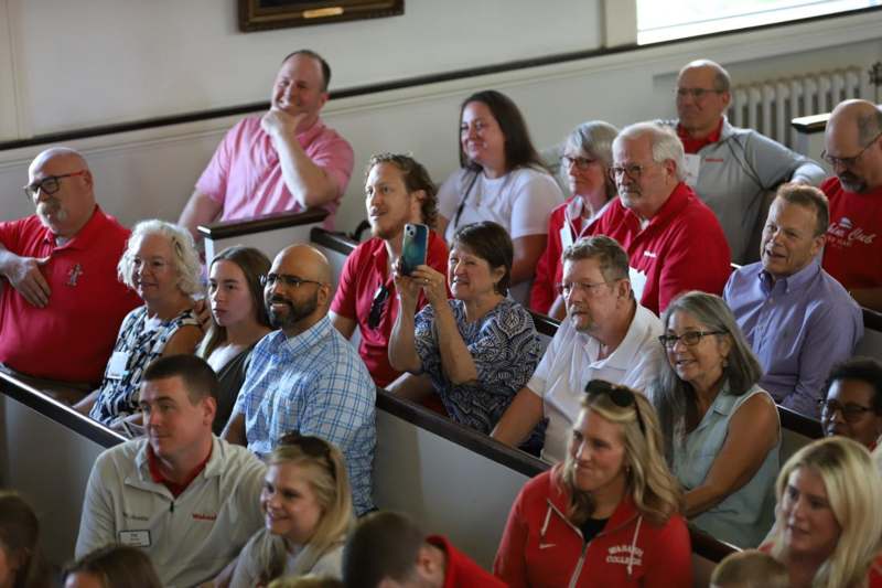 a group of people sitting in a church