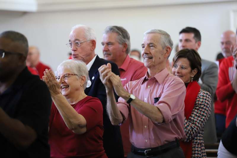 a group of people clapping