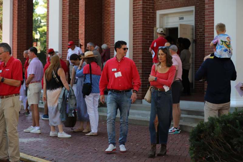 a group of people standing outside of a building