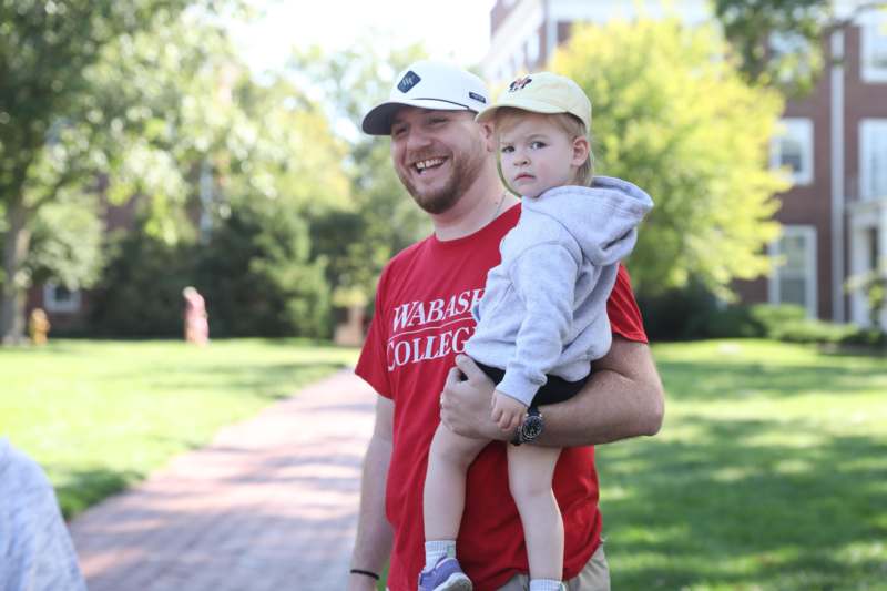 a man holding a baby