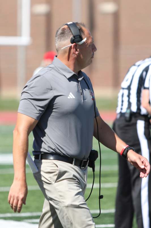 a man walking on a football field
