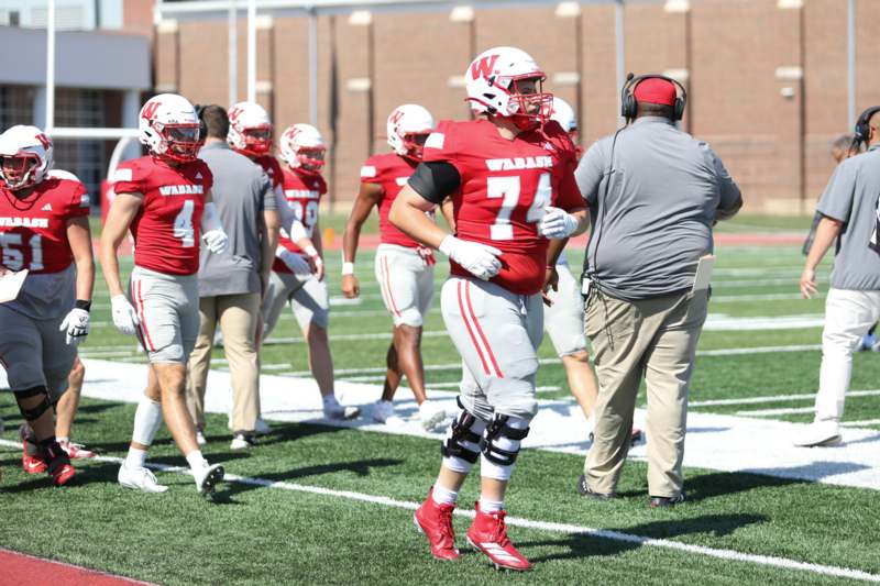 a football player in a red uniform