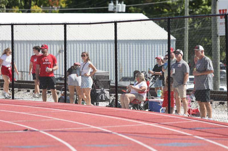 people standing on a track