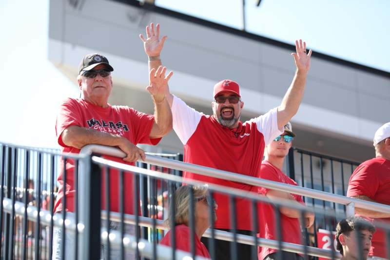 a group of people in red shirts