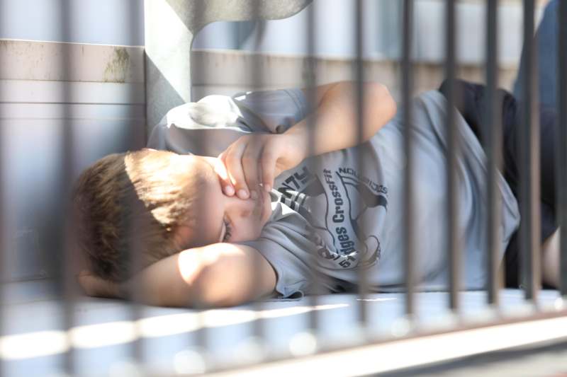 a boy lying on the floor