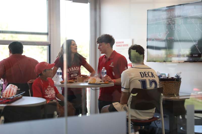 a group of people sitting around a table