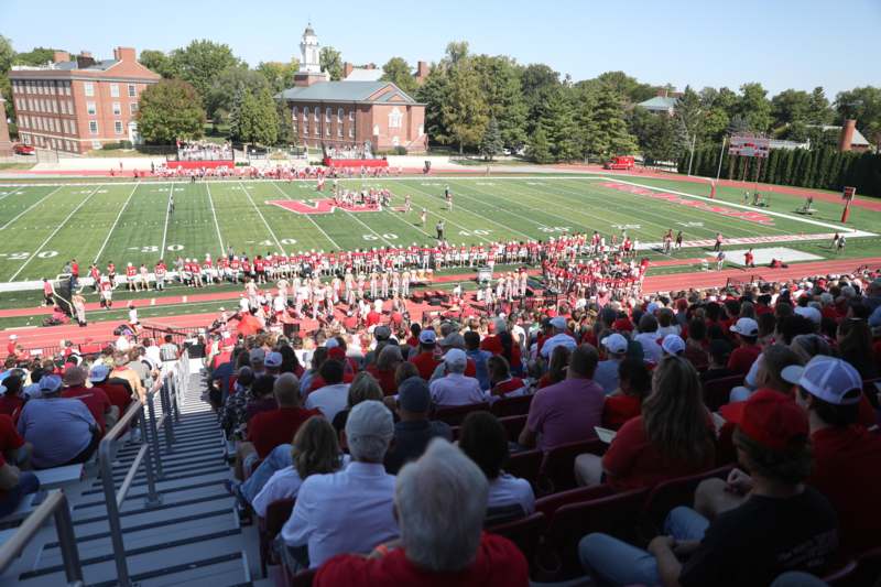 a football game with people watching