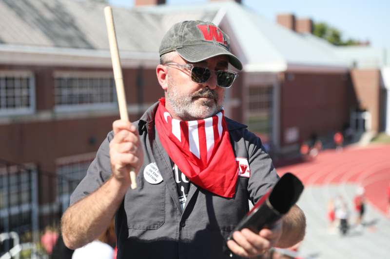 a man holding a stick