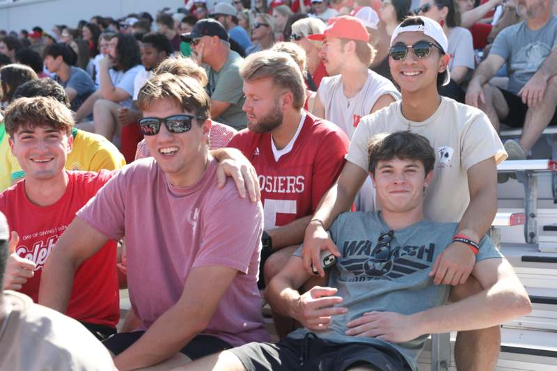 a group of people sitting in a crowd