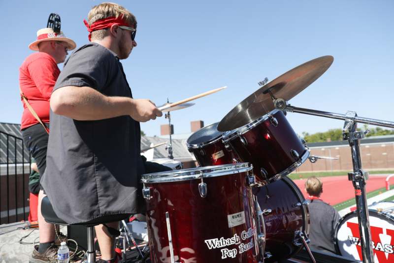 a man playing a drum set