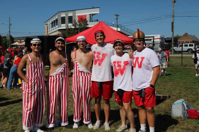 a group of men wearing matching outfits