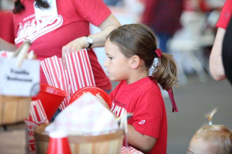 a girl in a red shirt