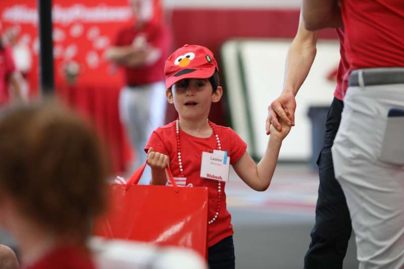 a child holding a bag