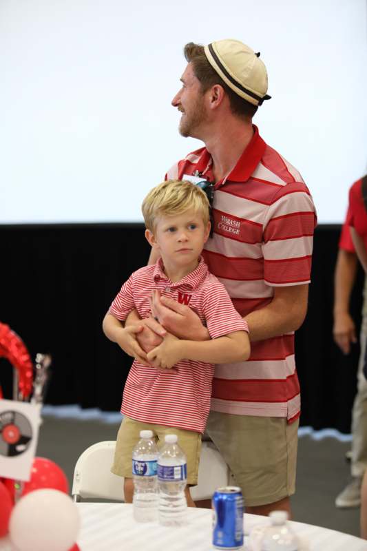 a man and child standing together