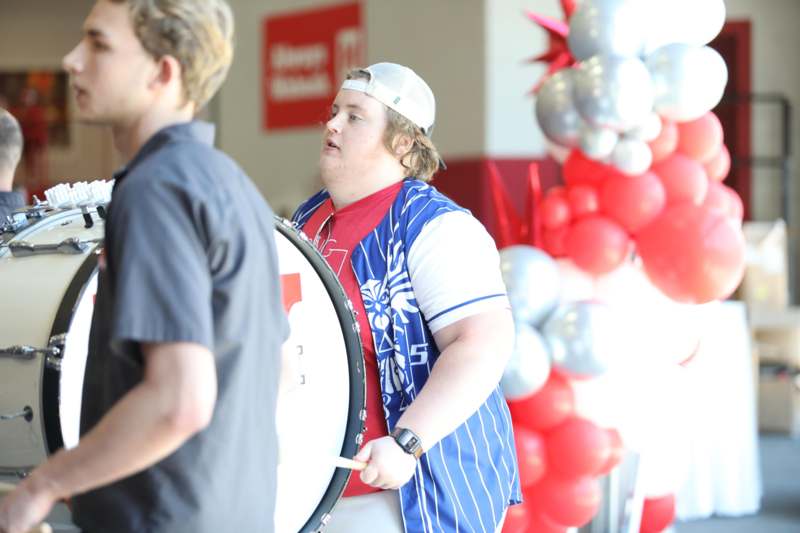 a man holding a drum