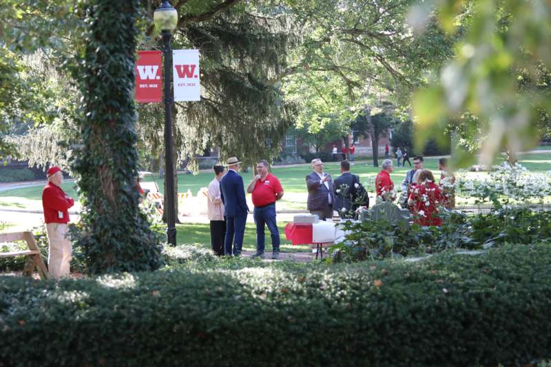 a group of people standing in a park