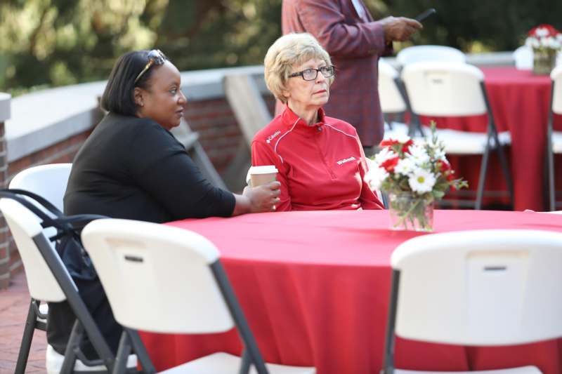 a group of women sitting at a table