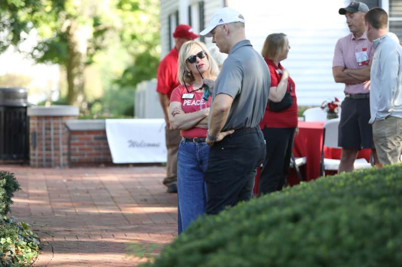 a man and woman standing outside