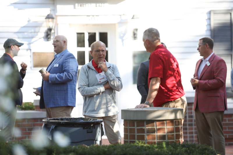 a group of men standing outside
