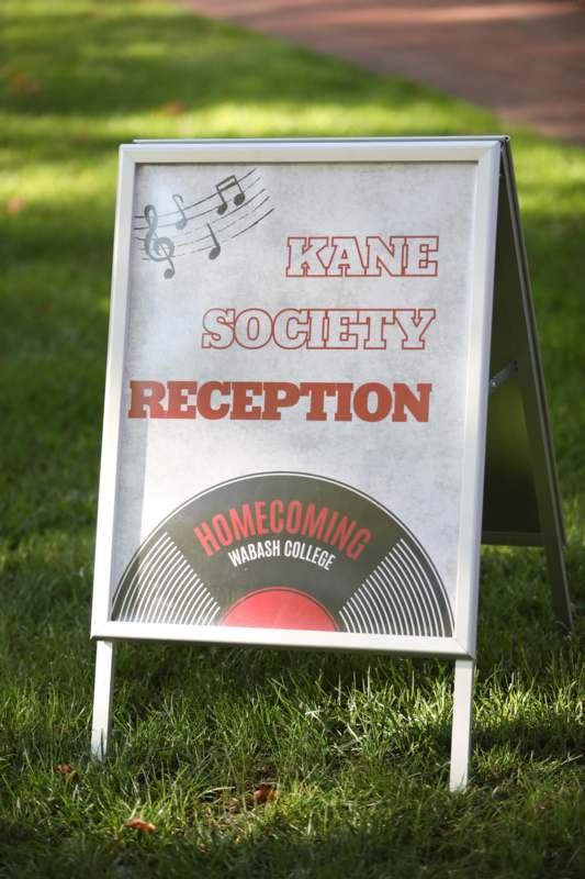 a sign on the grass