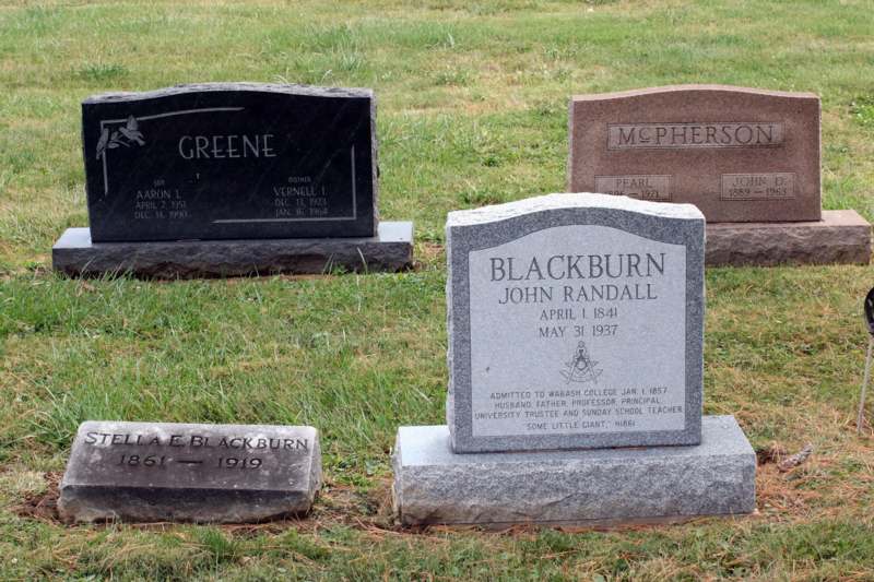 several headstones in a cemetery