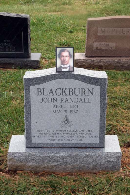 Blackburn Headstone Dedication Ceremony - a headstone with a picture of a man on it