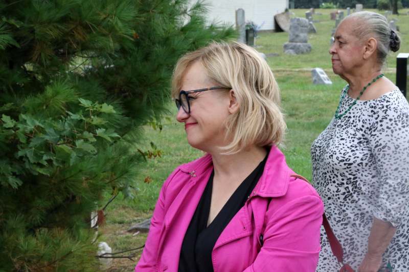 a woman in a pink jacket