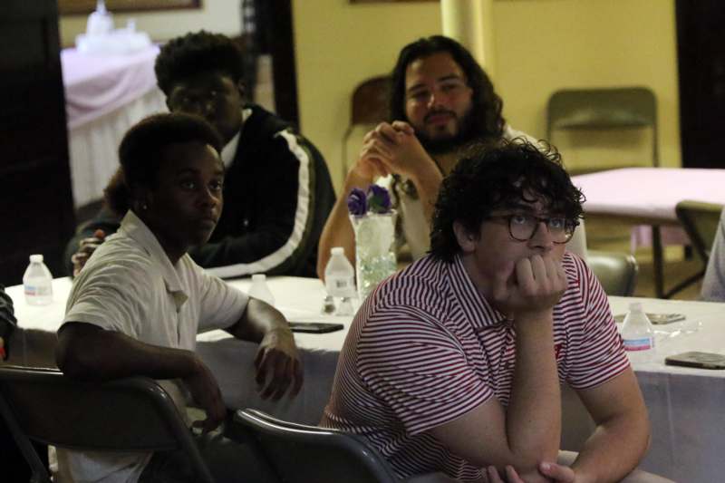 a group of people sitting at a table