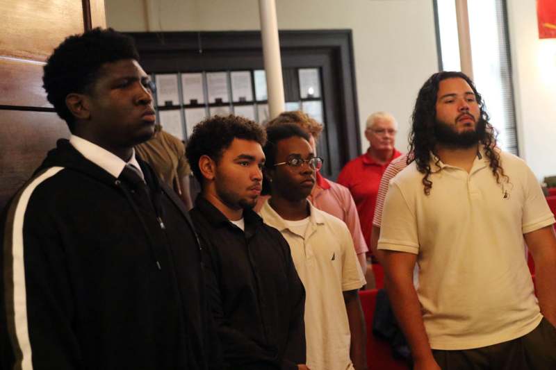 a group of people standing in a room