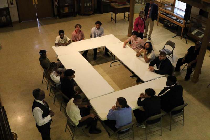 a group of people sitting around tables